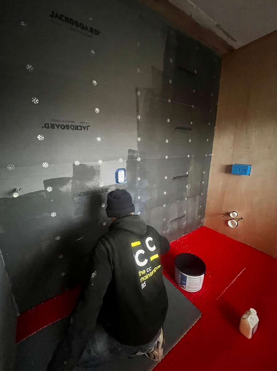 CC Maintenance engineer installing Jackoboard waterproofing membrane on site