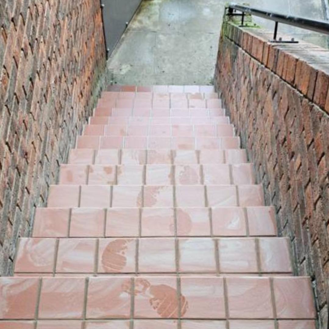 External staircase after — freshly re-tiled with new terracotta tiles