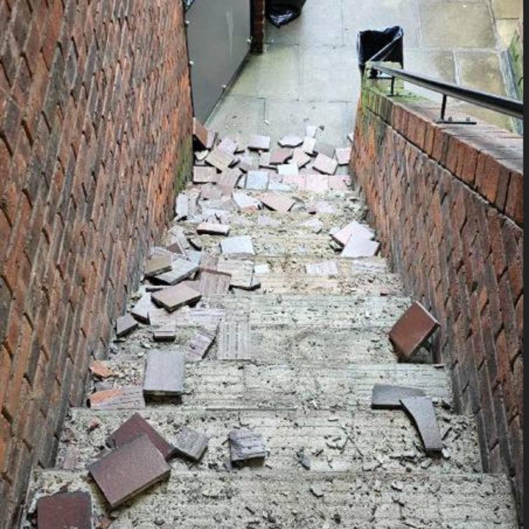 External staircase before — loose and disintegrated terracotta tiling